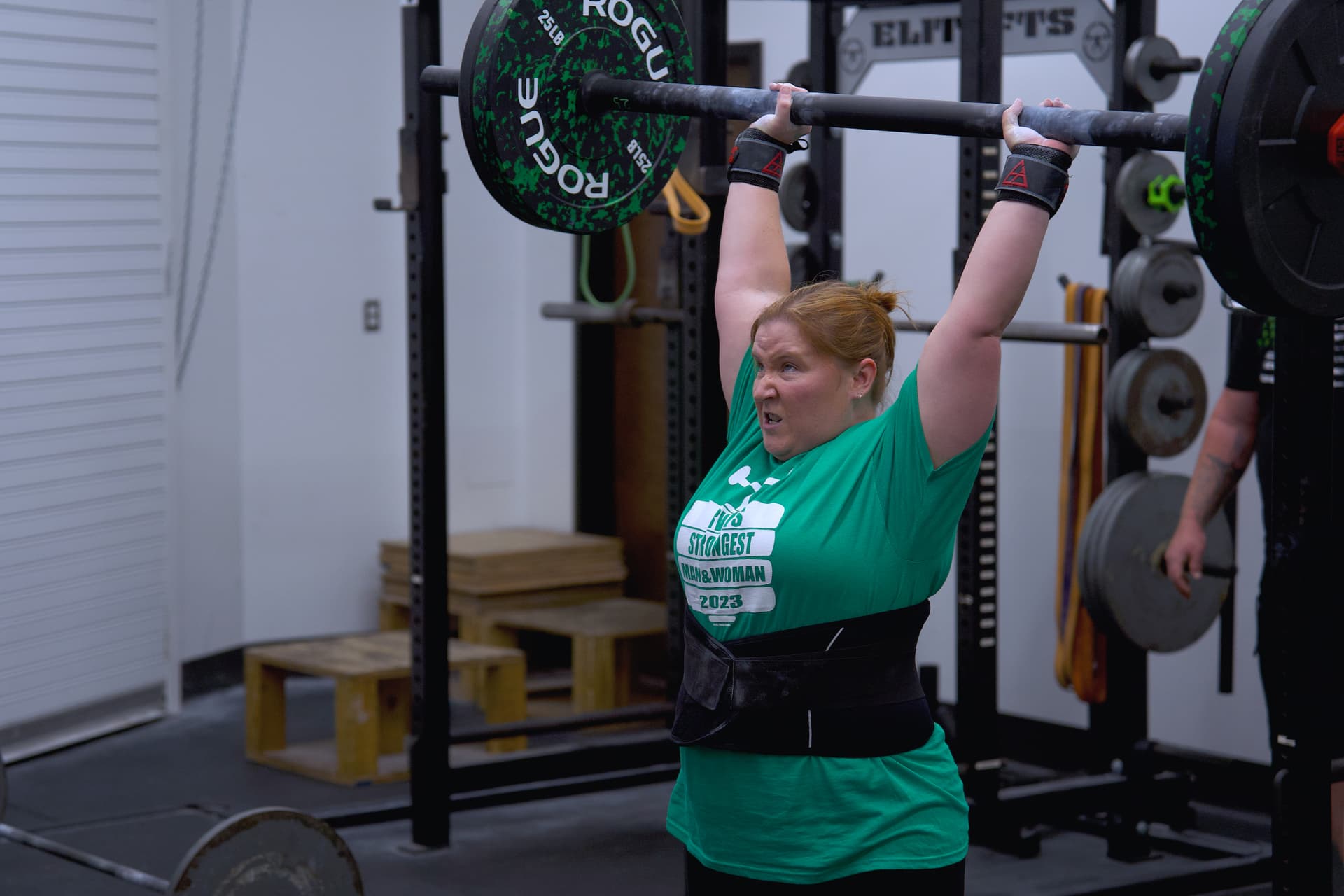 Athlete performing overhead press at X Factor Athletic Performance in Richmond VA